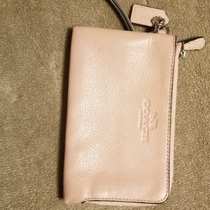 Soft pink Coach wristlet